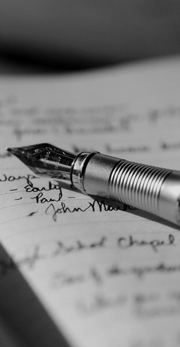 local St Pete A black and white photo of a fountain pen on a piece of paper.