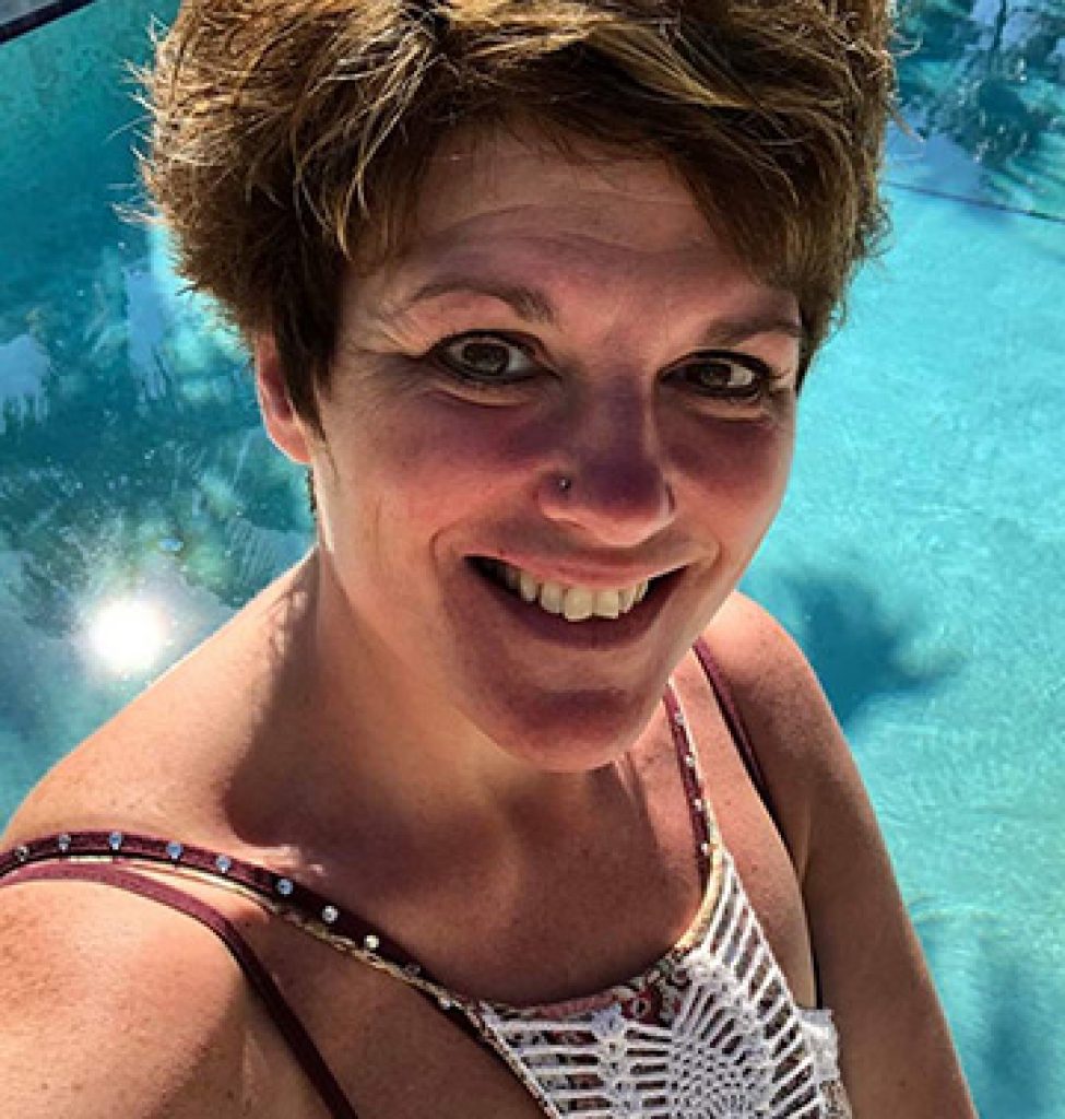 local St Pete A woman is taking a selfie in front of a pool in her neighborhood.